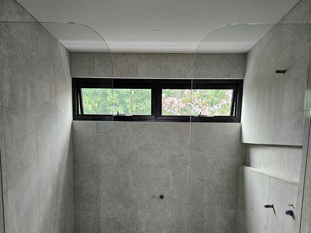 Curved glass shower screen installed by McLaren Vale Glass.
