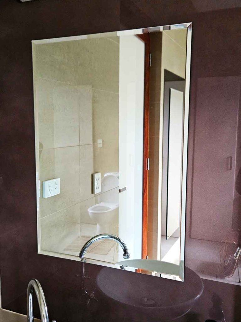 Mirror with custom glass surround installed by McLaren Vale Glass.